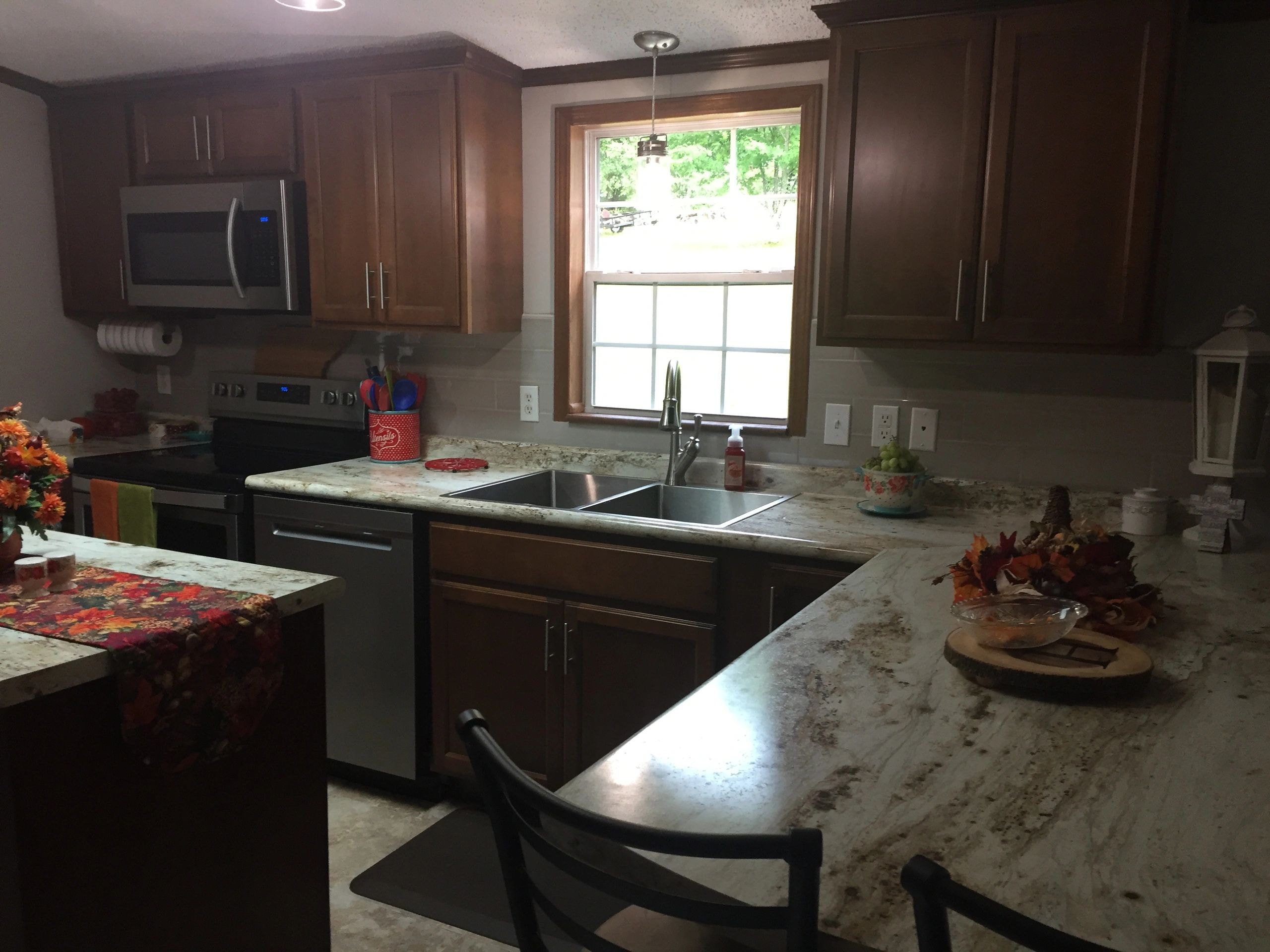 Modern kitchen remodel with white cabinets and quartz countertops